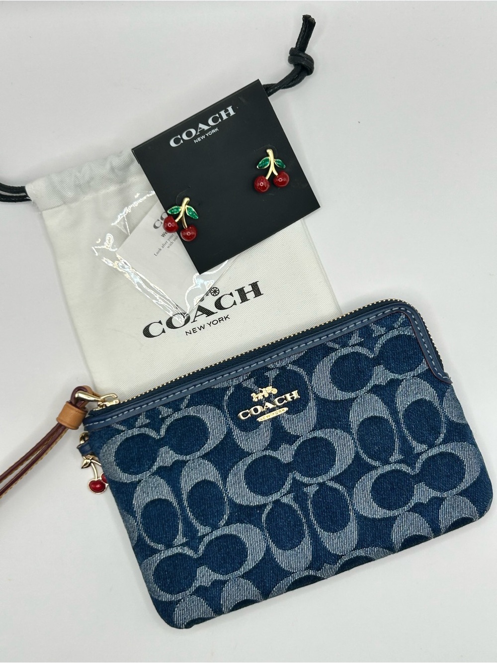 COACH Blue Denim Bundle Signature Wristlet with Red Cherry Charm and Earrings
